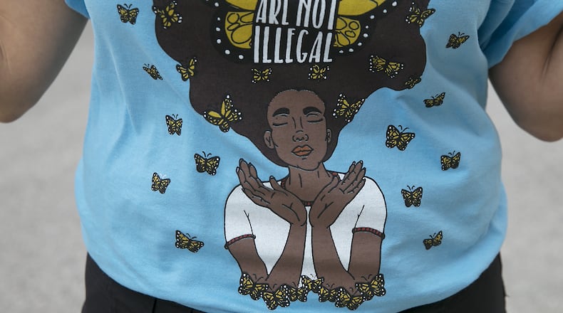 The Monarch butterfly is symbolic of migration as it's known to originate in Mexico and migrate across borders throughout its life-cycle. RALPH BARRERA / AMERICAN-STATESMAN