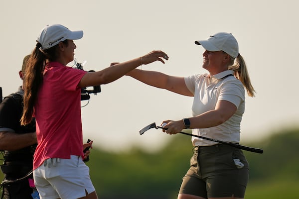 Maja Stark, of Sweden, hugs Julia Lopez Ramirez, of Spain, after winning the U.S. Women's Open golf tournament at Erin Hills Sunday, June 1, 2025, in Erin, Wis. (AP Photo/Jeff Roberson)