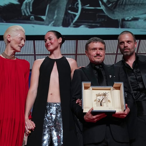 Tilda Swinton, left, poses with Renate Reinsve, Cristian Mungiu, winner of the Palme d'Or for 'Fjord' and Sebastian Stan during the awards ceremony at the 79th international film festival, Cannes, southern France, Saturday, May 23, 2026. (AP Photo/Andreea Alexandru)