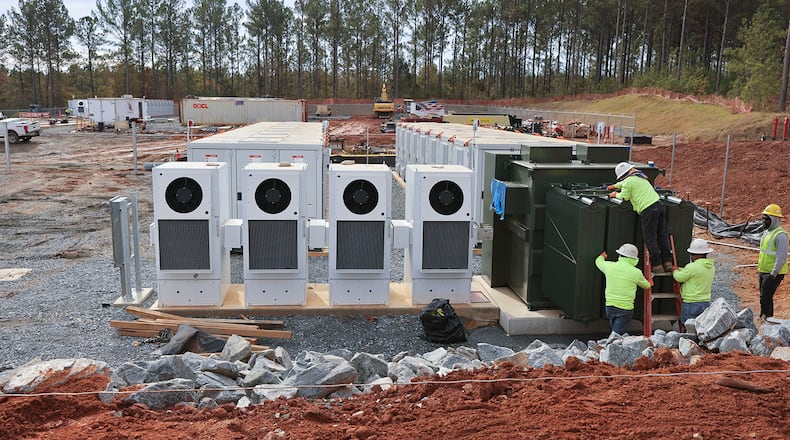 Workers install a new battery energy storage system that Georgia Power is constructing and bringing online in Columbus on Nov. 14. (Natrice Miller/Atlanta Journal-Constitution/TNS)