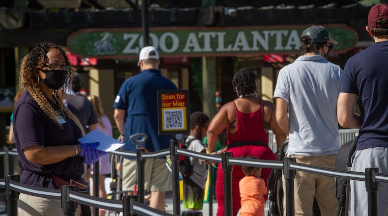 People line up to enter Zoo Atlanta on Saturday, May 16, 2020. The zoo is letting 150 people enter the zoo every half-hour. STEVE SCHAEFER FOR THE ATLANTA JOURNAL-CONSTITUTION