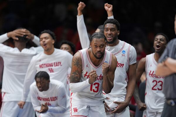 Houston's J'Wan Roberts (13) celebrates in the final minutes of the second half in the Elite Eight round of the NCAA college basketball tournament against Tennessee Sunday, March 30, 2025, in Indianapolis. (AP Photo/Michael Conroy)