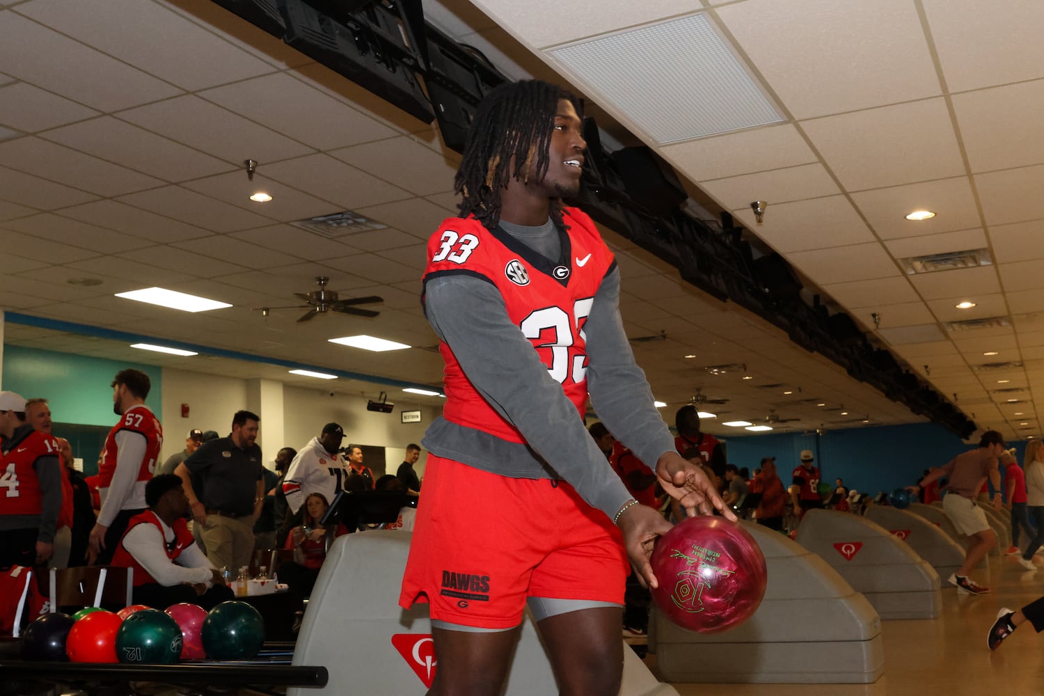UGA outside linebacker Quintavius Johnson bowls during the third annual Chick-fil-A Dawg Bowl fundraiser for Parkinson’s and Crohn’s disease research at Showtime Bowl in Athens on Wednesday, Oct. 22, 2025. (C.J. Bartunek for the AJC)
