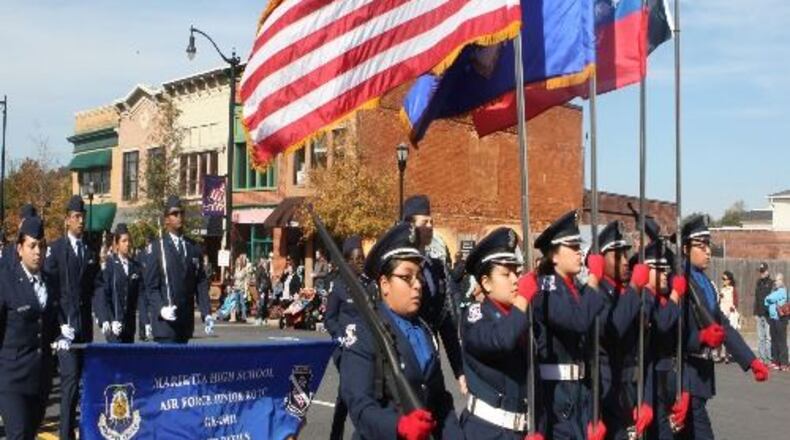 See the Marietta Veterans Day Parade from 10 a.m. to 1 p.m. Nov. 11 near the Marietta Square. Through Nov. 12, Operation Green Light is a call by Cobb County officials to show support for U.S. veterans by changing one light bulb in entryways to homes or businesses to green - just as the Cobb government building will be illuminated in green to show veterans they are seen, appreciated and supported. (Courtesy of Marietta)