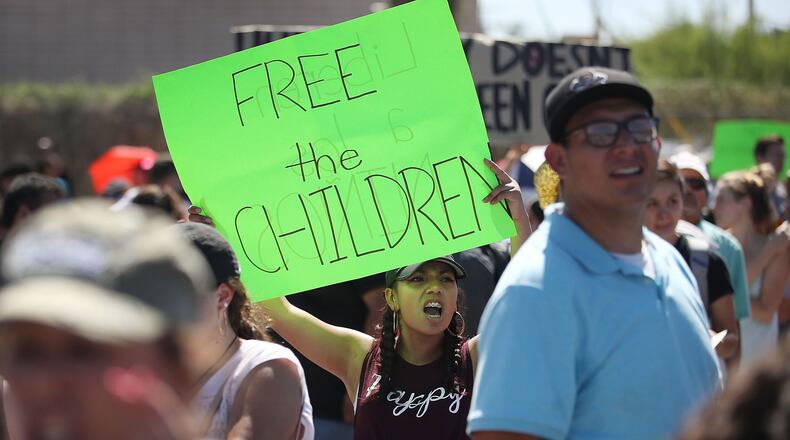 Bianey Reyes, center, and others protest the separation of children from their parents in front of the El Paso Processing Center, an immigration detention facility, at the Mexican border on June 19, 2018, in El Paso, Texas.