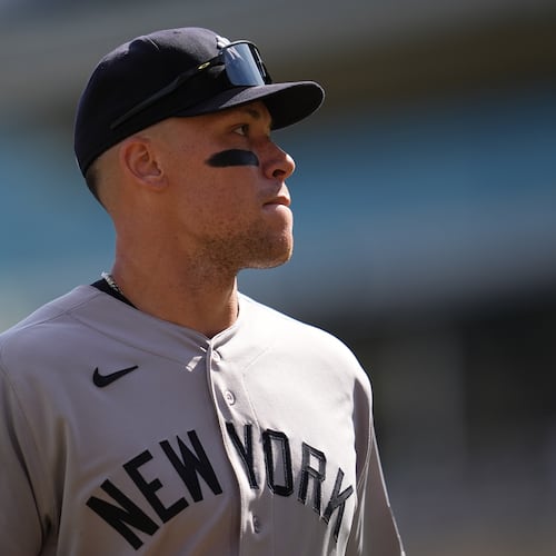 New York Yankees' Aaron Judge walks back to the dugout after the bottom of the fourth inning of a baseball game against the Minnesota Twins, Wednesday, Sept. 16, 2026, in Minneapolis. (AP Photo/Abbie Parr)