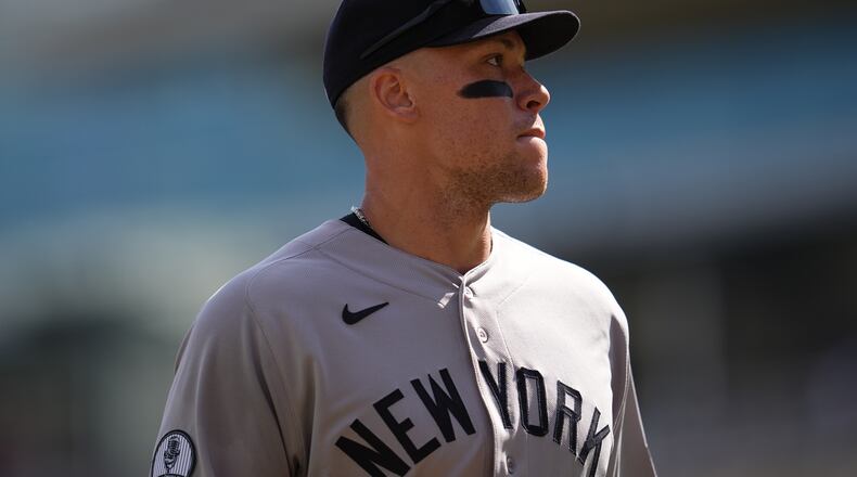 New York Yankees' Aaron Judge walks back to the dugout after the bottom of the fourth inning of a baseball game against the Minnesota Twins, Wednesday, Sept. 16, 2026, in Minneapolis. (AP Photo/Abbie Parr)