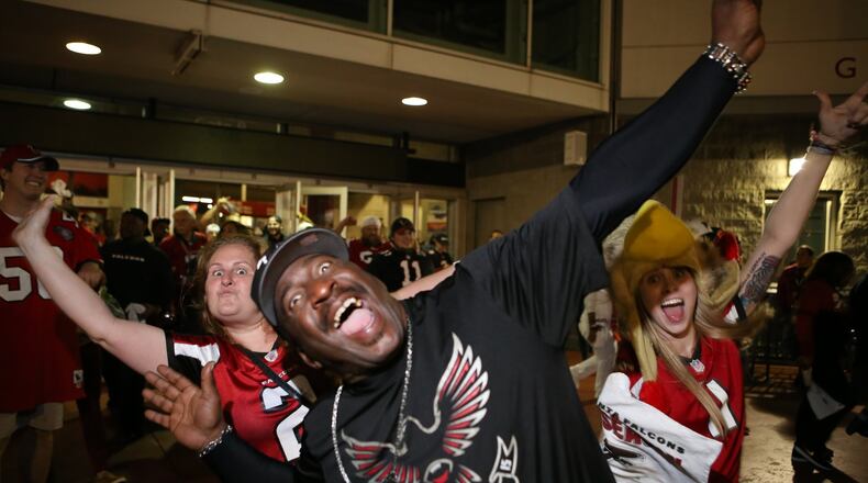 Fans roar with excitement as they leave the Georgia Dome after the Falcons’ win over the Seahawks on Saturday. (HENRY TAYLOR / HENRY.TAYLOR@AJC.COM)