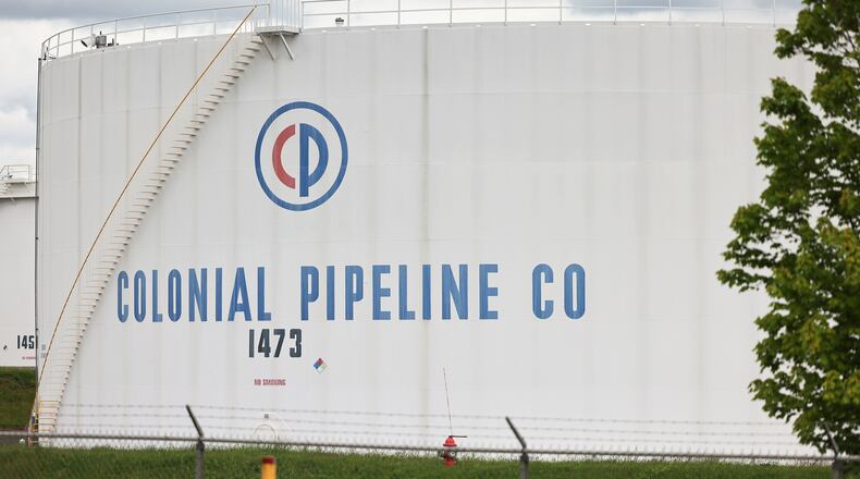 Fuel holding tanks are seen at Colonial Pipeline's Linden Junction Tank Farm on Monday, May 10, 2021, in Woodbridge, New Jersey. Alpharetta, Georgia-based Colonial Pipeline, which has the largest fuel pipeline, was forced to shut down its oil and gas pipeline system on Friday after a ransomware attack that has slowed down the transportation of oil in the eastern U.S. (Michael M. Santiago/Getty Images/TNS)