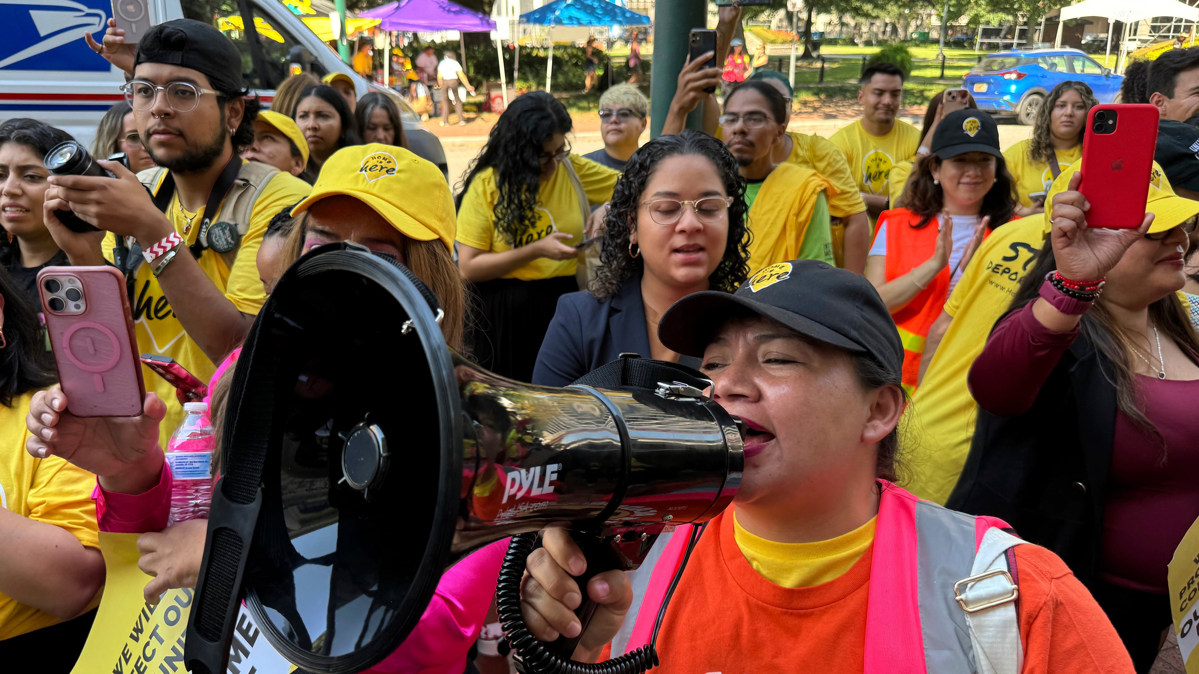 FILE - DACA supporter Claudia Valdivia wields a megaphone at a rally outside federal appeals court in New Orleans on Thursday, Oct. 10 ,2024. (AP Photo/Jack Brook, File)