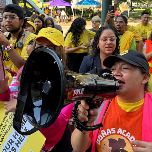 FILE - DACA supporter Claudia Valdivia wields a megaphone at a rally outside federal appeals court in New Orleans on Thursday, Oct. 10 ,2024. (AP Photo/Jack Brook, File)