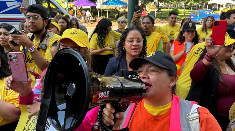 FILE - DACA supporter Claudia Valdivia wields a megaphone at a rally outside federal appeals court in New Orleans on Thursday, Oct. 10 ,2024. (AP Photo/Jack Brook, File)