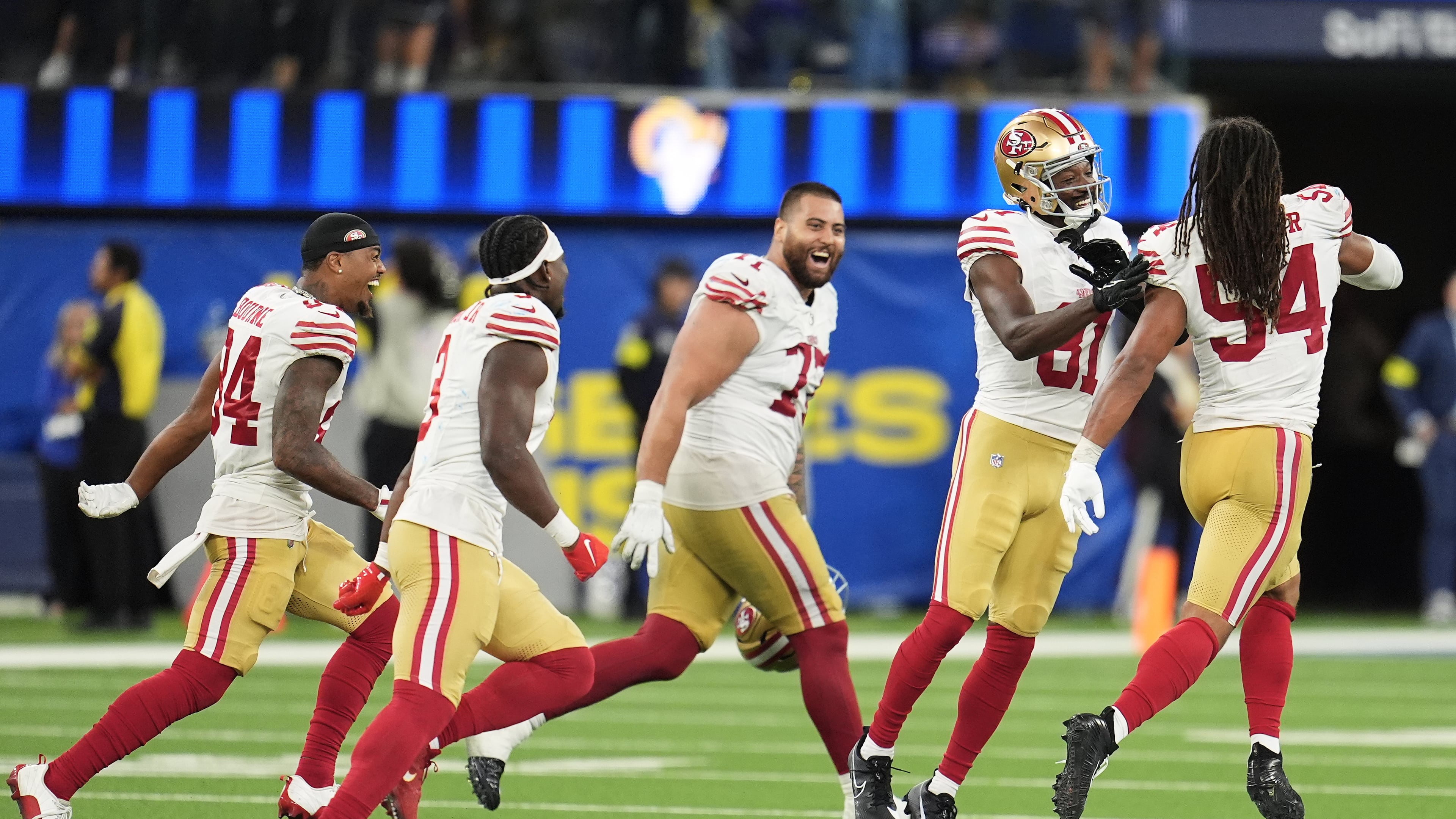 San Francisco 49ers players celebrate after defeating the Los Angeles Rams in overtime of an NFL football game, Thursday, Oct. 2, 2025, in Inglewood, Calif. (AP Photo/Marcio Jose Sanchez)
