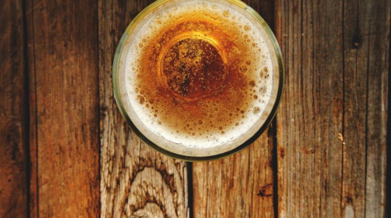 A bill that would have created a Canton restaurant district where drinks could be consumed outdoors has been vetoed by Mayor Gene Hobgood. AJC FILE