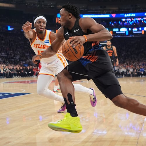 New York Knicks' OG Anunoby, right, drives past Atlanta Hawks' Onyeka Okongwu during the first half in Game 5 of a first-round NBA playoffs basketball series, Tuesday, April 28, 2026, in New York. (AP Photo/Frank Franklin II)