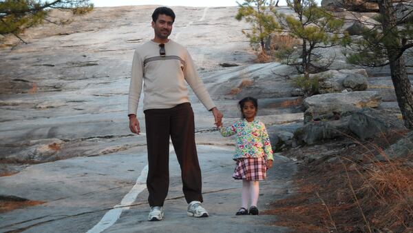 South Forsyth High School senior Rathna Malapati, 18, is seen here with her dad at age 3 during a visit to Stone Mountain. Sudhakar Malapati says his daughter has wanted to be a doctor as long as he can remember. (Courtesy of the Malapati family) 