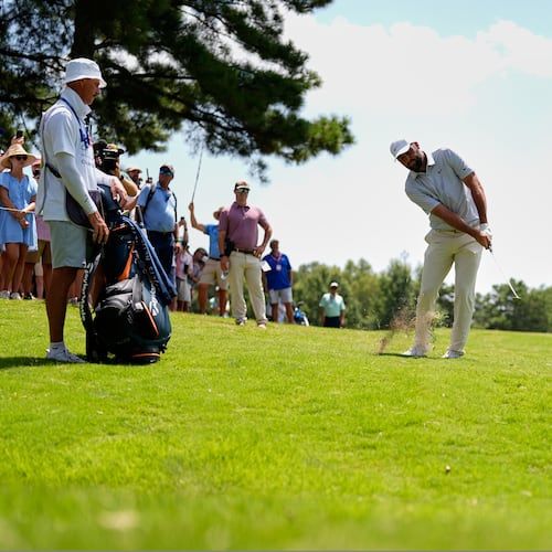 Scottie Scheffler chips onto the second green during the third round of the St. Jude Championship golf tournament Saturday, Aug. 15, 2026, in Memphis, Tenn. (AP Photo/George Walker IV)