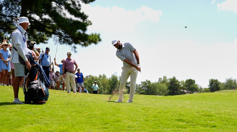 Scottie Scheffler chips onto the second green during the third round of the St. Jude Championship golf tournament Saturday, Aug. 15, 2026, in Memphis, Tenn. (AP Photo/George Walker IV)