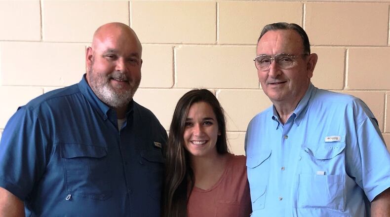 Three generations of Wests are the foundation of West Foods, doing business in Edison since 1967. Founder Richard West (right) has retired, but comes in every day to provide advice for his son John (left) and granddaughter Taylor. Photo: Kayla Moore