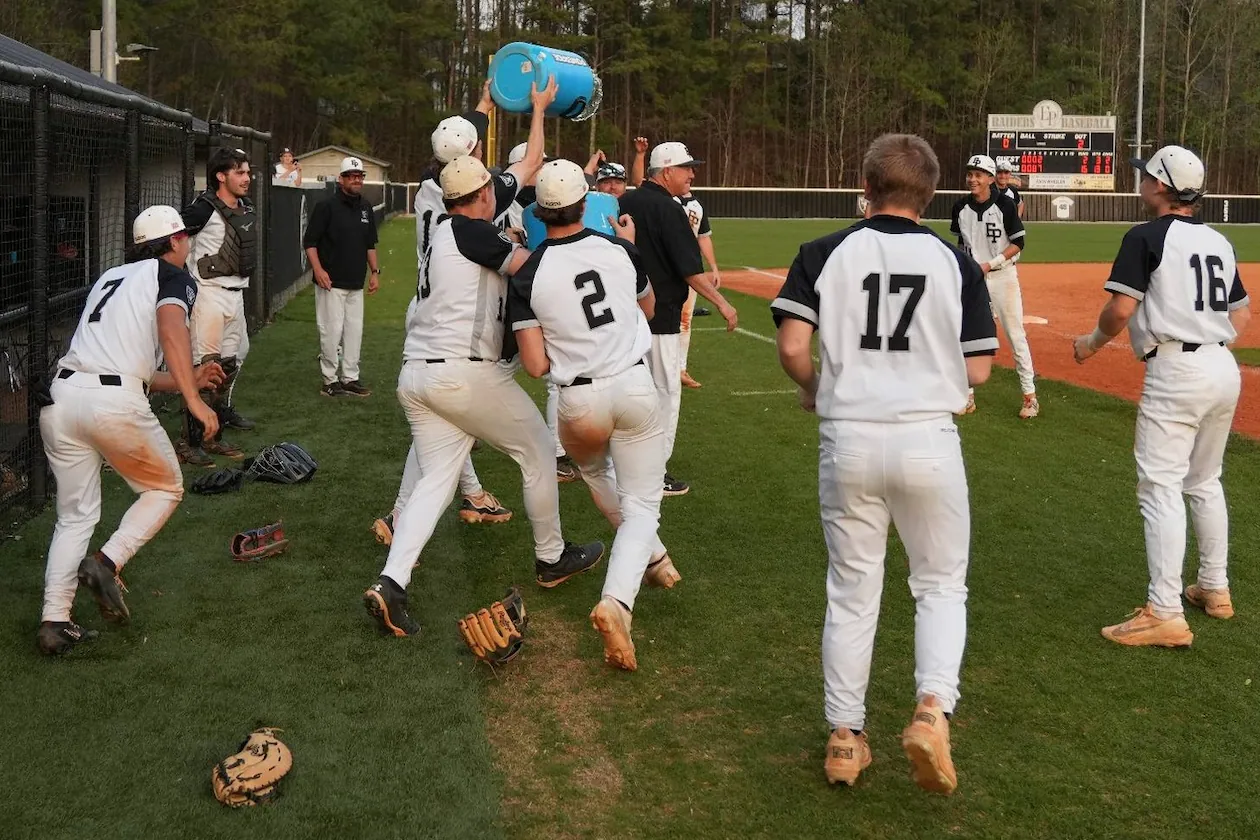 East Paulding players celebrate coach Tony Boyd's 600th victory March 27 in a 15-2 victory over Rome. (Courtesy of East Paulding High School)