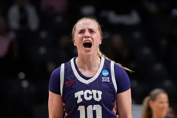TCU guard Hailey Van Lith (10) reacts after making a 3-point basket to close out the first half against Texas in the Elite Eight of the NCAA college basketball tournament, Monday, March 31, 2025. in Birmingham, Ala. (AP Photo/Gerald Herbert)
