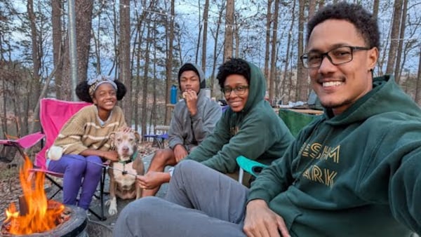 Lysa Moore, pictured with Mario Moore, right, and Isabelle and Eli Moore, left, was surprised to see the initial proposal for school closures in DeKalb County. (Photo courtesy Lysa Moore)