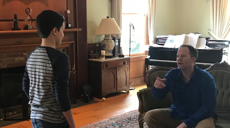 Shuler Hensley (right), Tony Award-winning actor and associate artistic director of the City Springs Theatre company, works with student Lukas DeLancey.