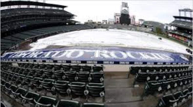 Snow is not uncommon at Coors Field in April and May, and the Braves have now played in three of the five coldest games in the history of the ballpark after starting Friday’s game in 27-degree temperatures. (AP file photo)