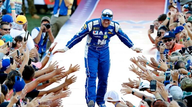 Dale Earnhardt, Jr.,  is welcomed during during pre-race driver introductions at the NASCAR Coke Zero 400 race, at Daytona International Speedway,  in Daytona Beach, Fla., Saturday, July 1, 2017. (Joe Burbank/Orlando Sentinel)  2941322