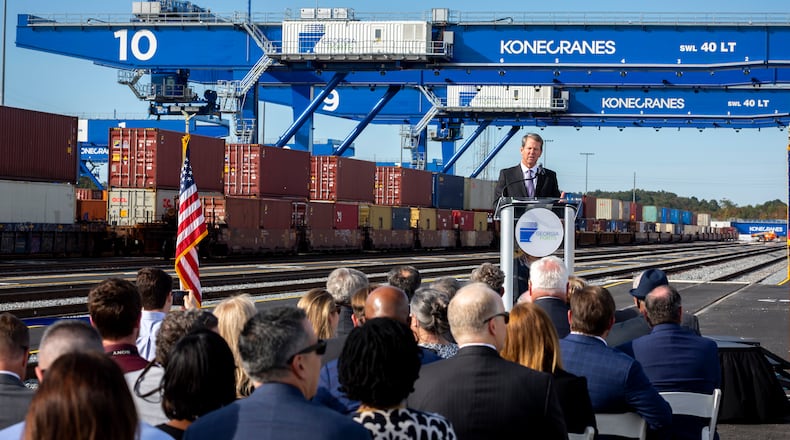 Gov. Brian Kemp speaking at event marking the opening of all 18 working tracks at the Georgia Port Authority's Mason Mega Rail Terminal at the Port of Savannah in November. The lines are meant to help handle the continued surge in cargo coming through the port. (AJC Photo/Stephen B. Morton)