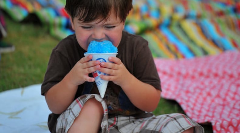 Jack Dewit, 2, eats a snow cone at Friends for the East Cobb Park Movie Night at East Cobb Park Saturday July 7, 2012. More than 300 people attended the free event. Concession stands sales benefit Friends for the East Cobb Park.