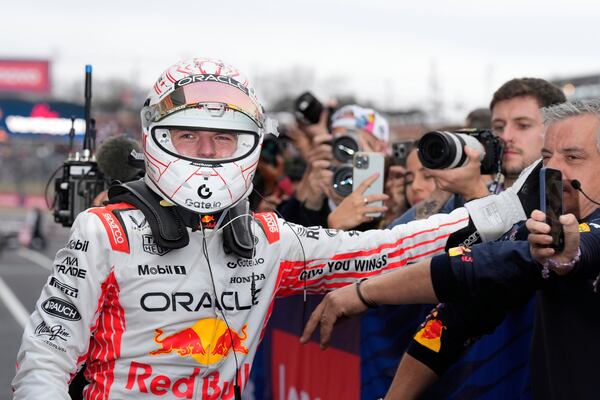 Red Bull driver Max Verstappen of the Netherlands celebrates after winning the Japanese Formula One Grand Prix race at the Suzuka Circuit in Suzuka, central Japan, Sunday, April 6, 2025. (AP Photo/Shuji Kajiyama, Pool)