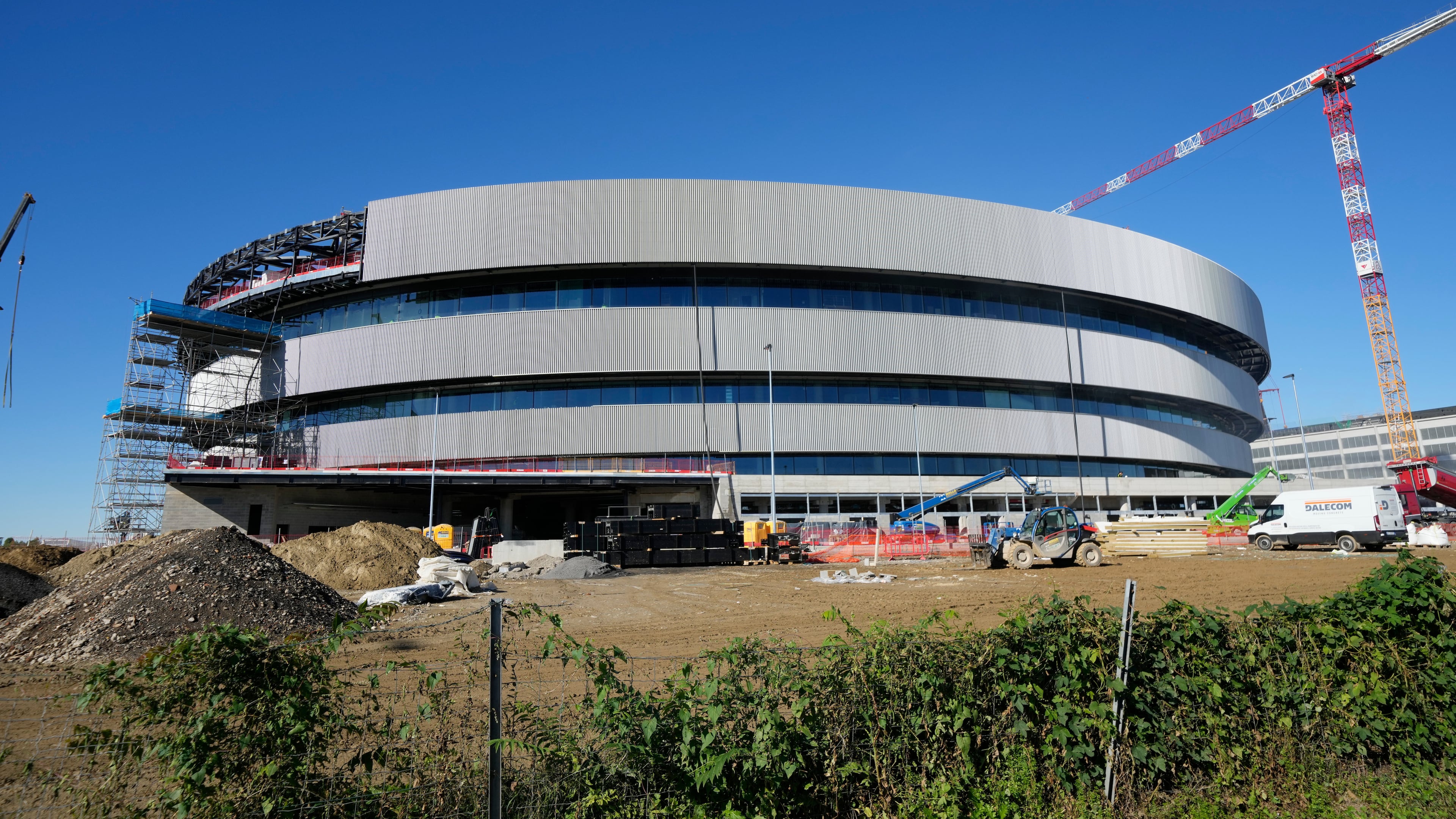FILE - An outside view of the Santa Giulia Ice Hockey Arena, in Milan, where Ice Hockey discipline of the Milan Cortina 2026 Winter Olympics will take place Italy, Friday, Oct. 24, 2025. (AP Photo/Luca Bruno, File)