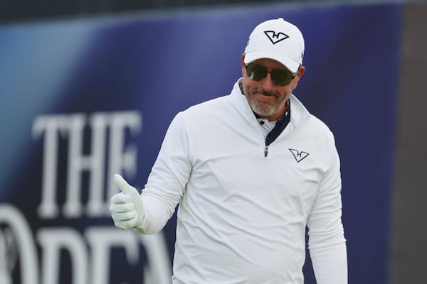 Phil Mickelson of the United States acknowledges the crowd as he walks off the 1st tee after playing his shot during the first round of the British Open golf championship at the Royal Portrush Golf Club, Northern Ireland, Thursday, July 17, 2025. (AP Photo/Peter Morrison)