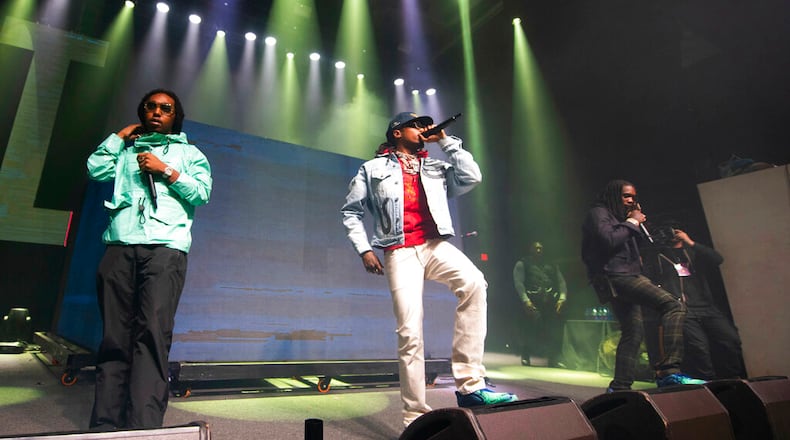 Takeoff, from left, Quavo, and Offset, of Migos, perform onstage at the Capitol Records Super Bowl Party at the Masquerade on Friday, Feb. 1, 2019, in Atlanta. (Photo by Paul R. Giunta/Invision/AP)