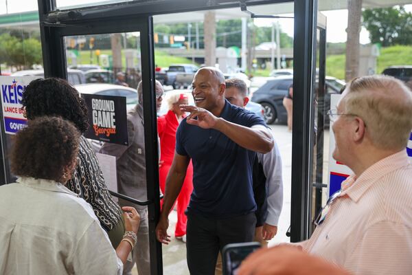 Maryland Gov. Wes Moore enters to speak at a rally ahead of a canvassing event for Georgia gubernatorial candidate Keisha Lance Bottoms and U.S. Sen. Jon Ossoff in East Point on Tuesday. (Arvin Temkar/AJC)