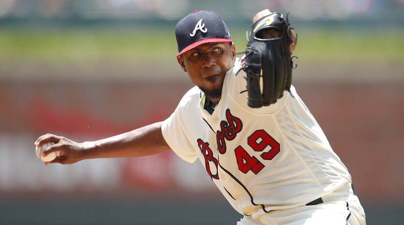 Julio Teheran delivers a pitch in the first inning Sunday, when he took a two-hit shutout to the seventh against the Diamondbacks. (Photo by Todd Kirkland/Getty Images)