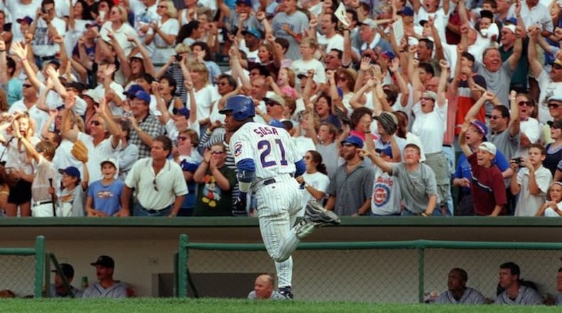 The Chicago Cubs' Sammy Sosa watches as his 62nd home run of the season sails over the fence against the Milwaukee Brewers at Wrigley Field in Chicago on September 13, 1998. (Phil Velasquez/Chicago Tribune/TNS)