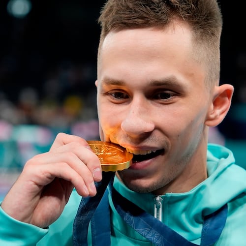 FILE - Ivan Litvinovich of the Individual Neutral Athletes celebrates after winning the gold medal during the men's trampoline finals in Bercy Arena at the 2024 Summer Olympics, Friday, Aug. 2, 2024, in Paris, France. (AP Photo/Charlie Riedel, File)