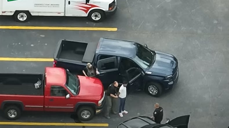 Cherokee County deputies take 27-year-old Parth Patel, of Ontario, Canada, into custody on charges related to a suspected $200,000 scam.