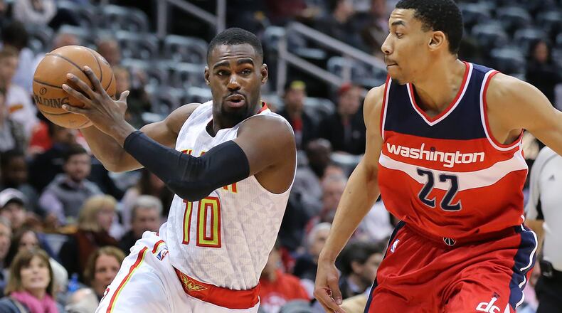 Hawks guard Tim Hardaway, Jr. drives against Wizards Otto Porter in a basketball game on Monday, March 21, 2016, in Atlanta. Curtis Compton / ccompton@ajc.com