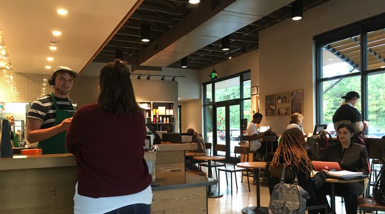 A Starbucks in Marietta became the office for displaced Florida residents whose Cobb County hosts lost power after Irma. ELLEN ELDRIDGE / ELLEN.ELDRIDGE@AJC.COM