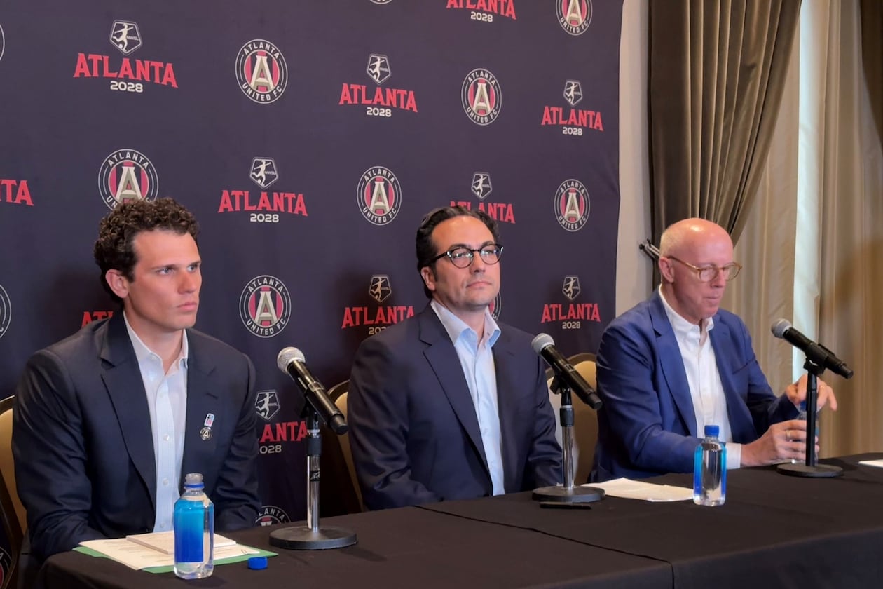 Mauricio Culebro (center), the president of soccer for Atlanta United and the city's upcoming NWSL franchise, answers questions at his introductory press conference. Josh Blank (left), vice president of executive for AMBSE, and Rich McKay (right), CEO of AMBSE, also took part. (Amna Subhan/AJC)
