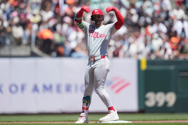 Philadelphia Phillies' Bryce Harper gestures after hitting a double against the San Francisco Giants during the sixth inning of a baseball game in San Francisco, Wednesday, July 9, 2025. (AP Photo/Jeff Chiu)