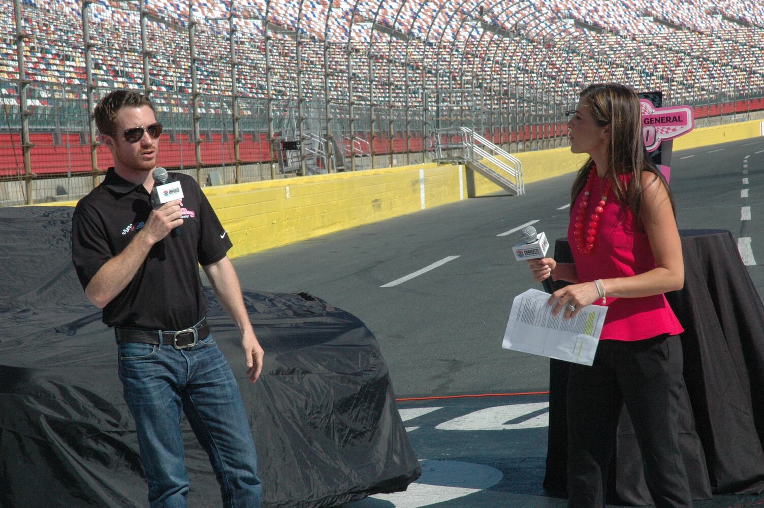 IMAGES: NASCAR drivers, breast cancer survivors paint pit road pink