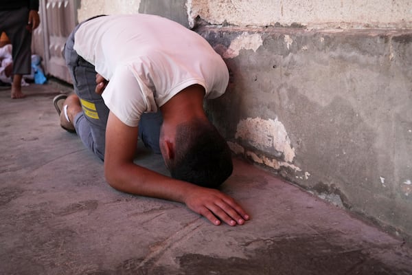 Youssef Abd Rabbo weeps at the hospital where the body of his mother Manal was taken together with 10 more people, including two women and five children, killed in an Israeli strike while they were waiting to receive nutritional supplements at a Project Hope-run medical clinic in Deir al-Balah, Gaza Strip, Thursday, July 10, 2025.(AP Photo/Abdel Kareem Hana)