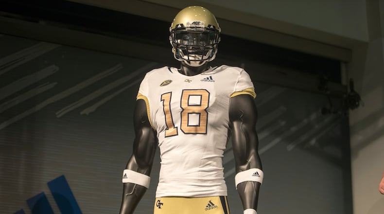 The new Georgia Tech football uniforms are displayed at Ventanas during a uniform reveal party in Atlanta, Friday, August 3, 2018. The university collaborated with Adidas to create new uniforms for the 2018 season.  (ALYSSA POINTER/ALYSSA.POINTER@AJC.COM)