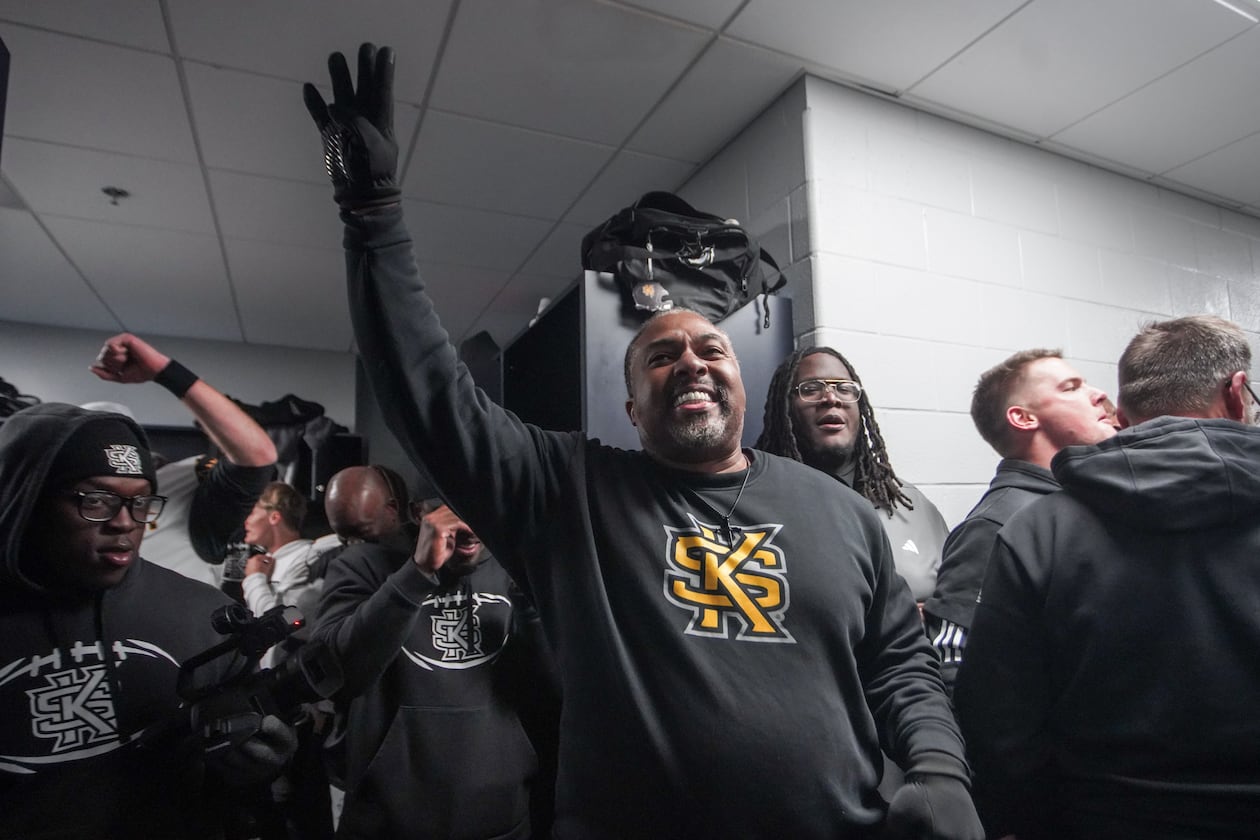 Kennesaw State coach Jerry Mack celebrates in the locker room after the Owls defeated Liberty in overtime to earn a spot in the CUSA championship game. (Courtesy of Kennesaw State Athletics)