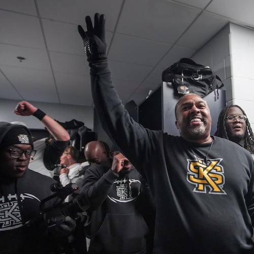 Kennesaw State coach Jerry Mack celebrates in the locker room after the Owls defeated Liberty in overtime to earn a spot in the CUSA championship game. (Courtesy of Kennesaw State Athletics)