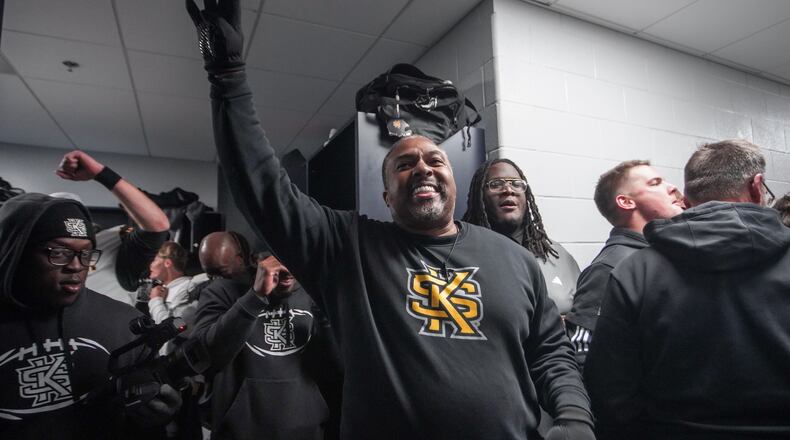 Kennesaw State coach Jerry Mack celebrates in the locker room after the Owls defeated Liberty in overtime to earn a spot in the CUSA championship game. (Courtesy of Kennesaw State Athletics)
